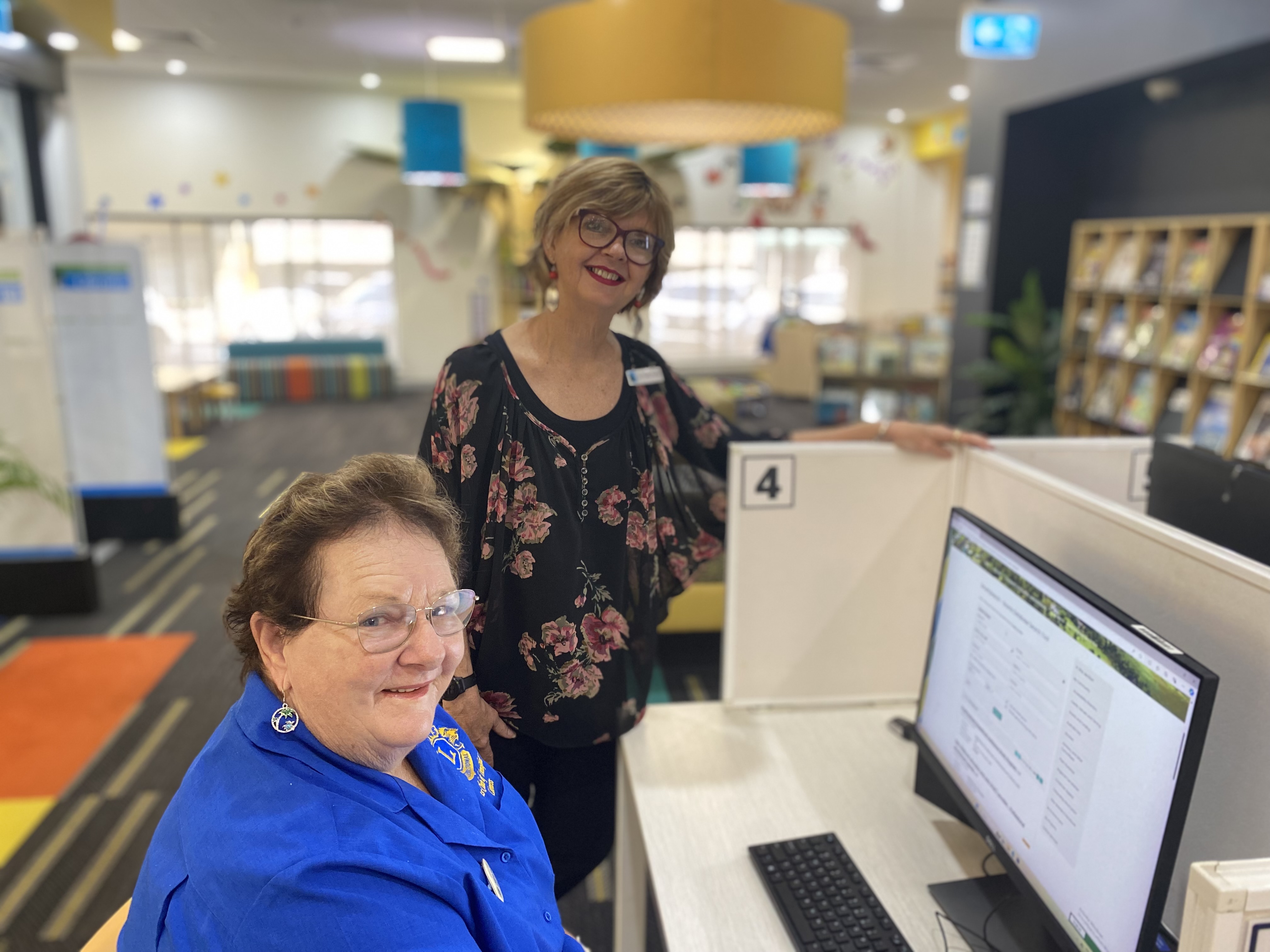 Heather westcott lionesslions club innisfail search for grants with councillor trudy tschui at innisfail library