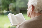 Elderly man reading shutterstock rz